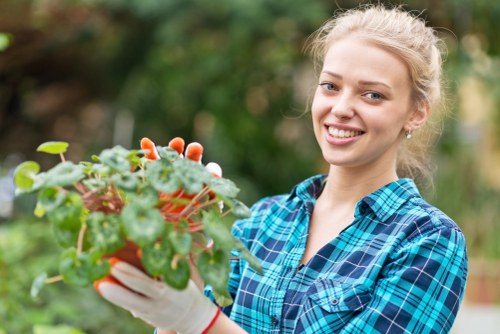 Gardener arriving at a landscaped site with tools